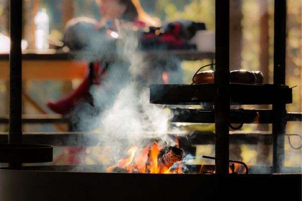Chef guiding students through culinary techniques