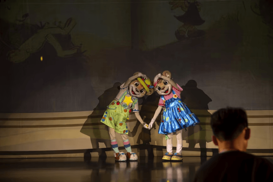 Young performers from T3 Triple Threat showcasing theater skills on stage