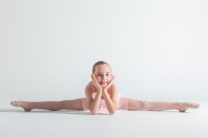 Student building confidence on stage with arts education in acting